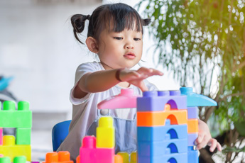 Child stacking blocks