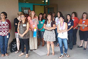 Staff members standing together outside