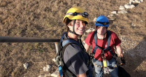 two students with construction gear on