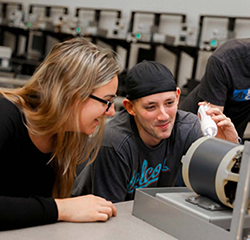 Santa Fe Community College students working on a project together