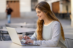 Young teacher engaged in a training webinar