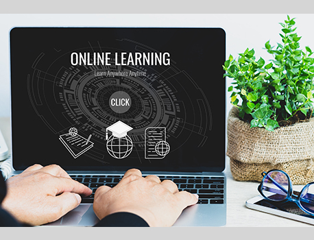 Teacher logging into online learning webinar via laptop