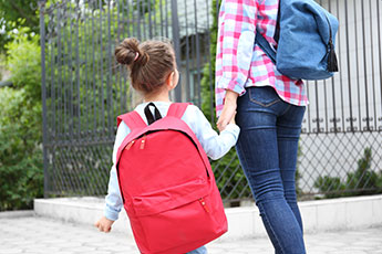 Parent taking child to school